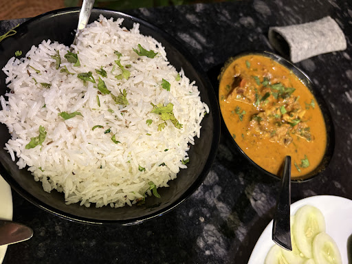 Kerala fish curry served with fragrant rice